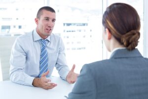 Woman interviewing with two employers.