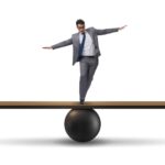 Manager on a seesaw trying to balance autonomy