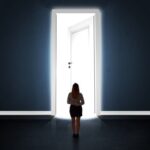 Image of woman standing in front of door, nervous about returning to work after an illness.