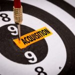 Talent Acquisition Image - Dart board with the word acquisition for bulls-eye.
