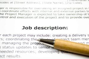 Zoomed in image of job description with pen
