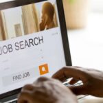 Job seeker performing job search on computer