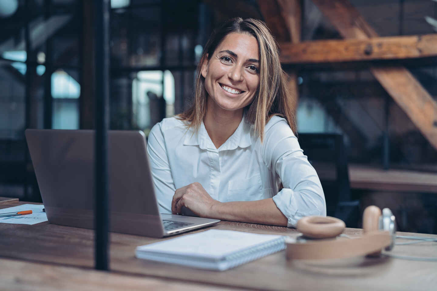 Woman in office, smiling
